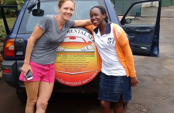 Tourist with Uganda Car rental representative