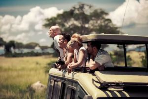 Uganda tourists in safari land cruiser